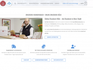 Screenshot Der Startseite Der Druckerei Hemmersbach + Online Druckerei Köln Mit Empfangsbereich Und Serviceinformationen